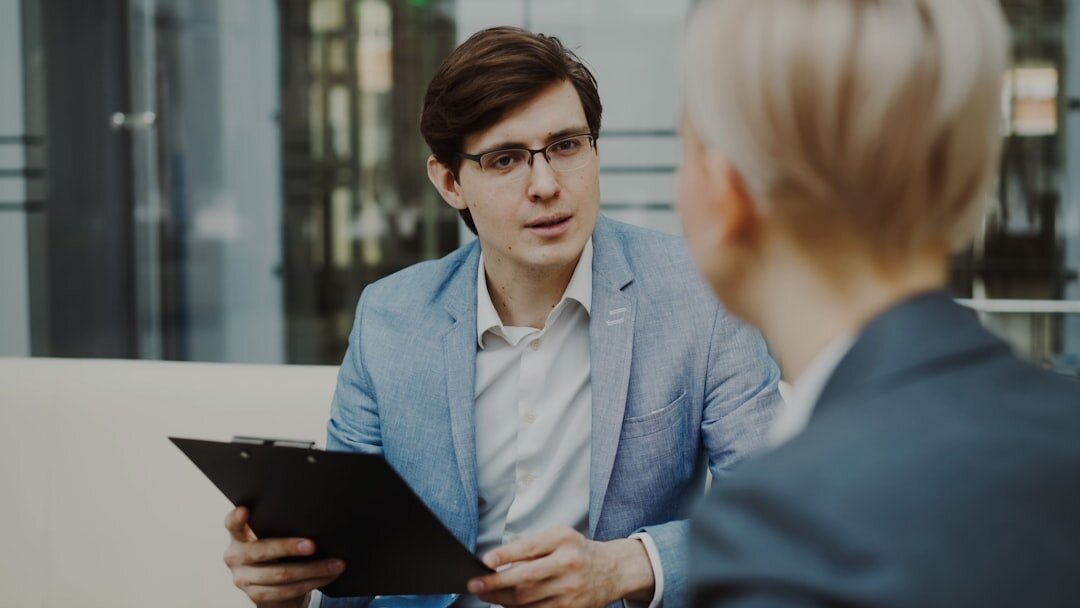man in suit giving interview